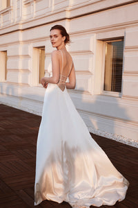 Bride in white silk wedding dress with strap back detail